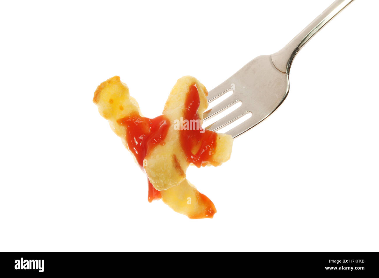 Potato chips with tomato ketchup on a fork isolated against white Stock Photo