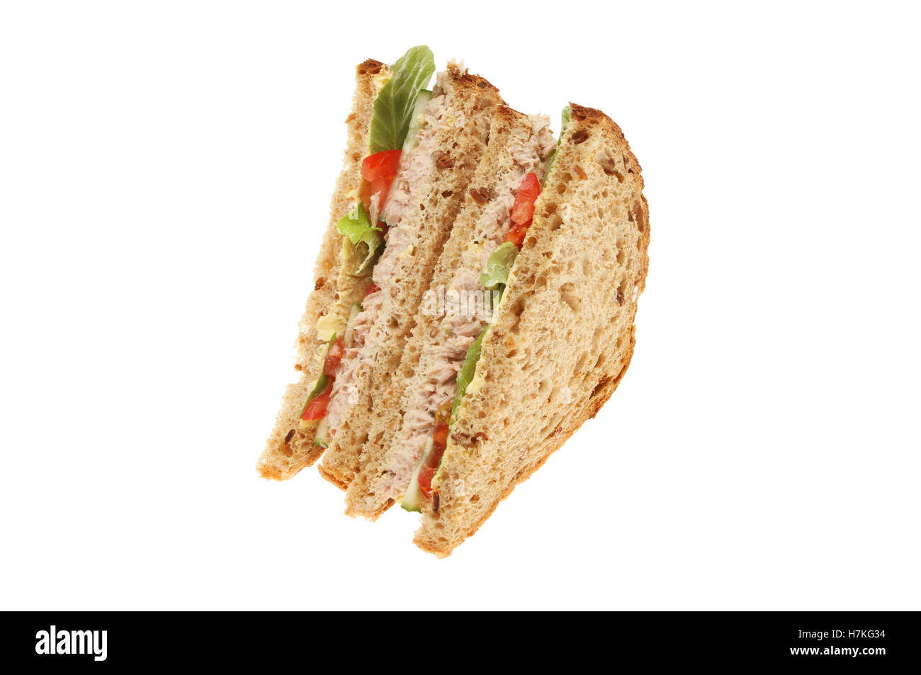 Tuna mayonnaise and salad brown bread sandwiches isolated against white