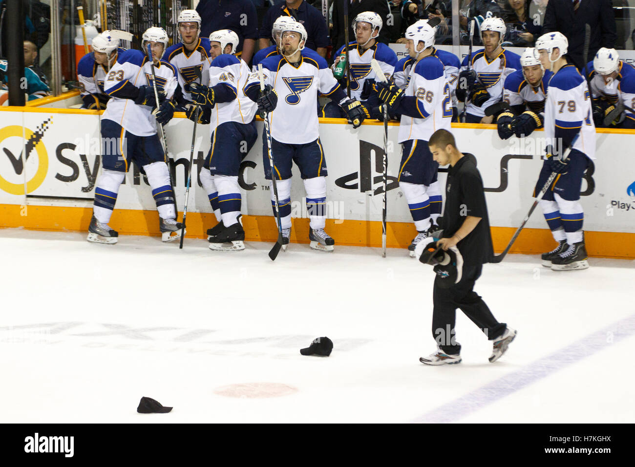 March 19, 2011; San Jose, CA, USA;  The St. Louis Blues watch as fans throw hats on the ice celebrating a hat trick scored by San Jose Sharks center Joe Pavelski (not pictured) during the second period at HP Pavilion. Stock Photo