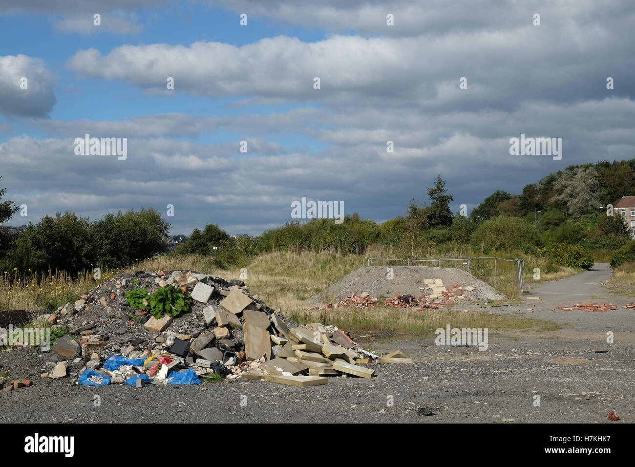 builders' rubble dumped on urban waste ground Stock Photo