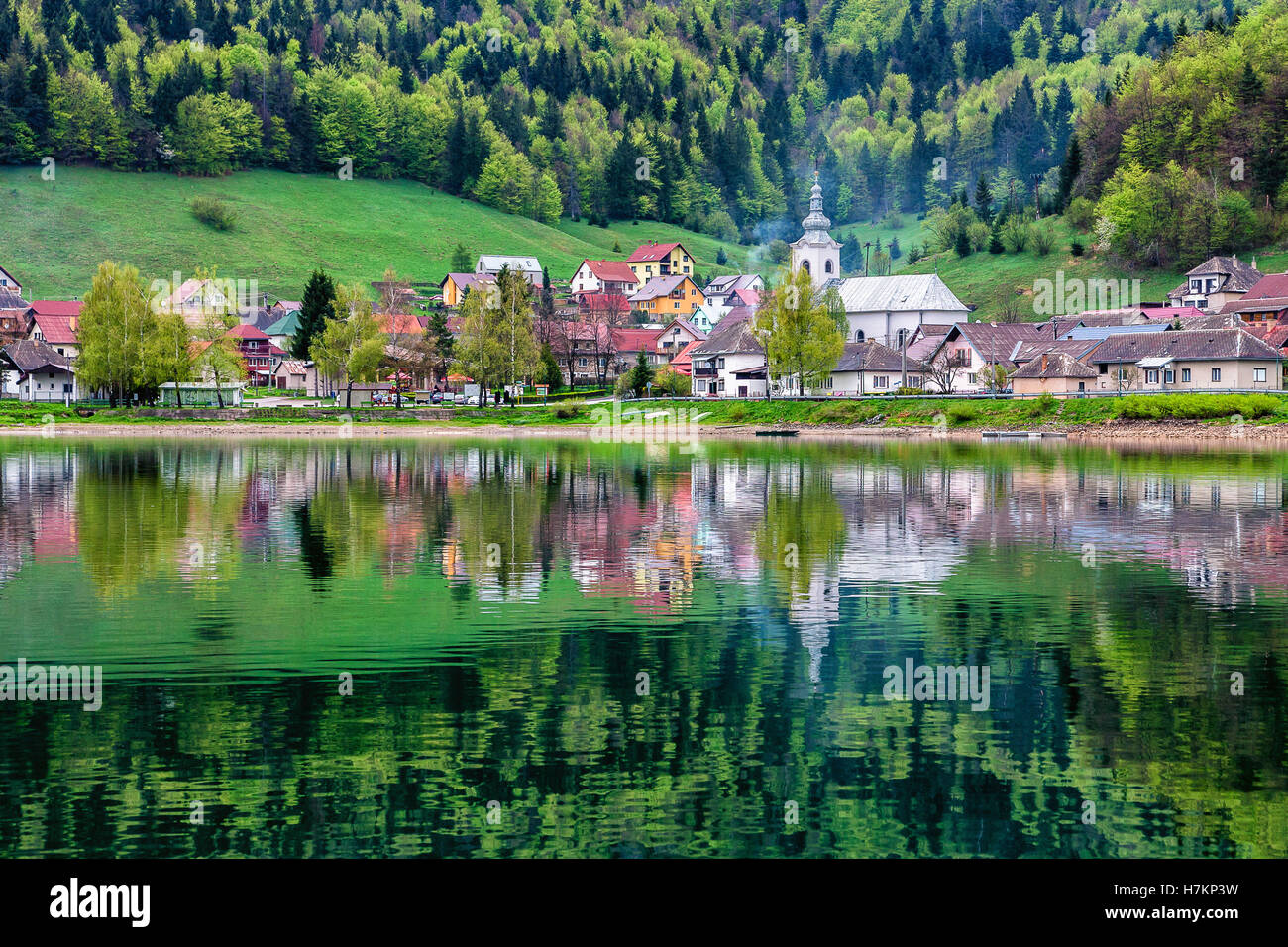 Village reflected in lake - Dedinky, Slovakia Stock Photo
