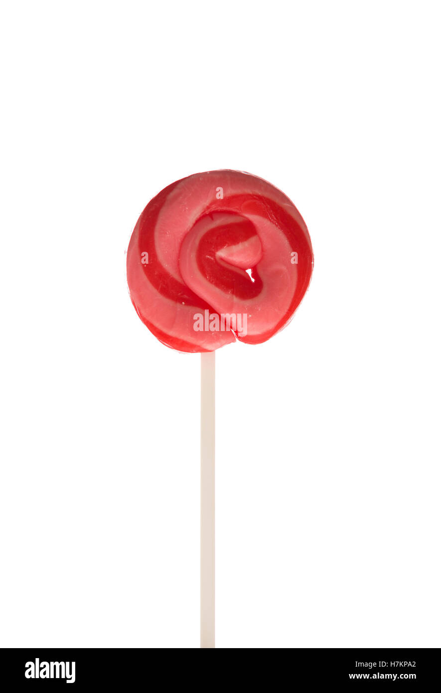 Red, pink, white stripe swirl candy lollipop on white background Stock