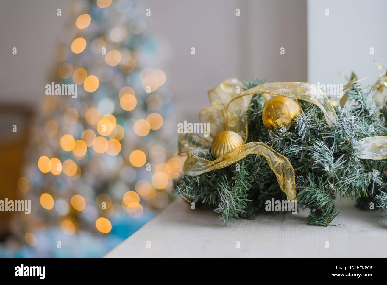 Gold and blue Christmas background of defocused lights with decorated