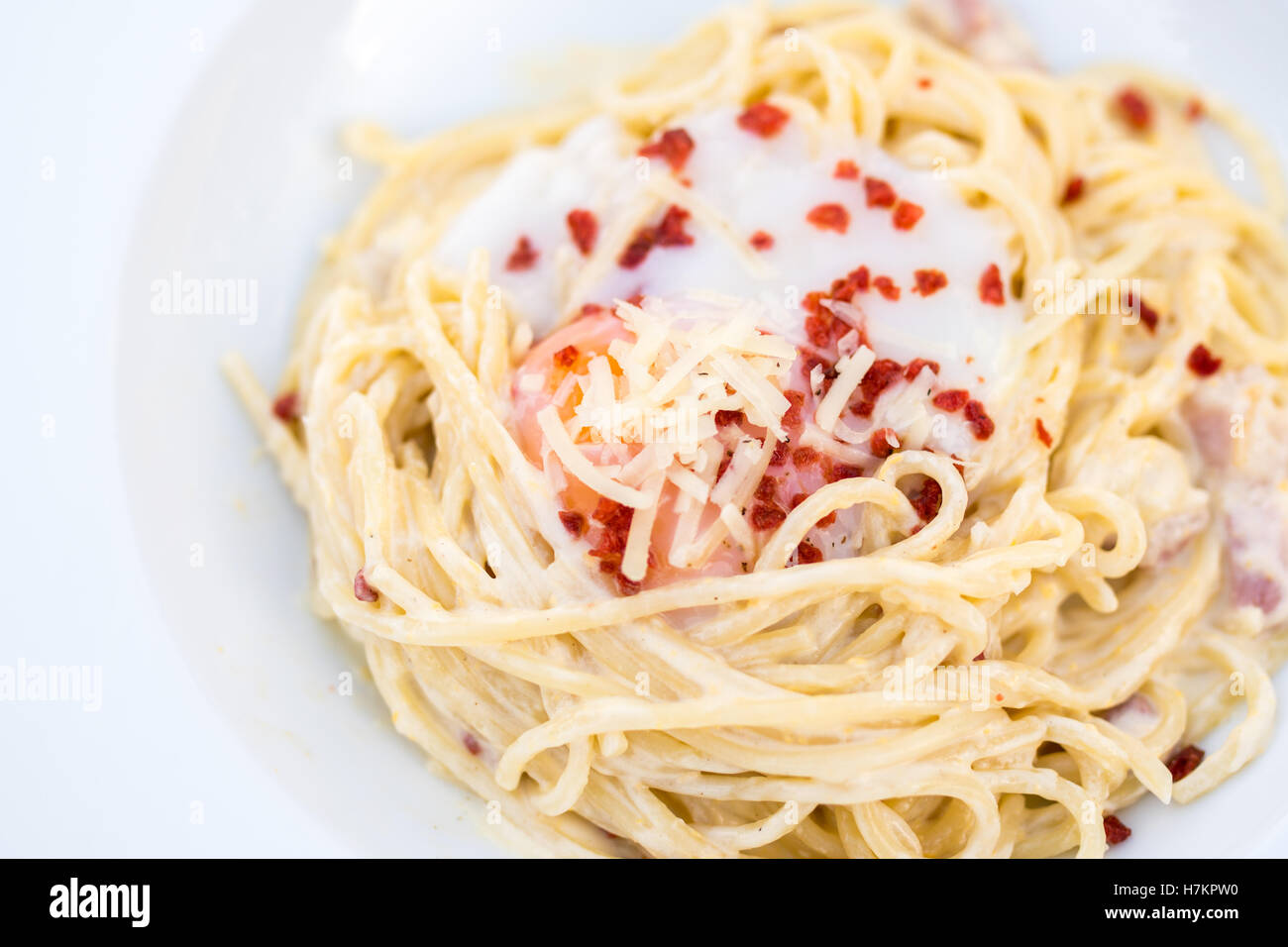 spaghetti carbonara with bacon and egg yolk Stock Photo Alamy