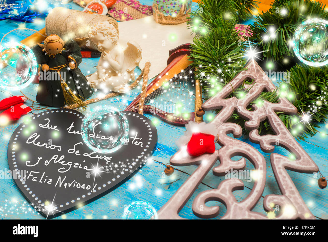 Christmas greetings card, Christmas ornaments and good wishes message in Spanish Language Stock Photo
