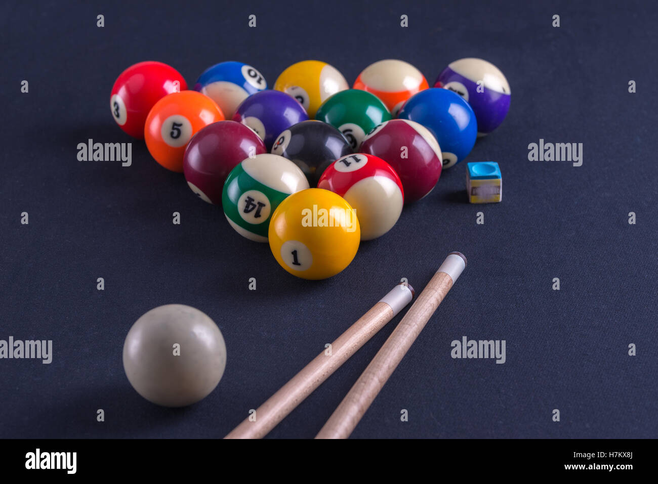 Blue billiard table with balls and cue. Stock Photo