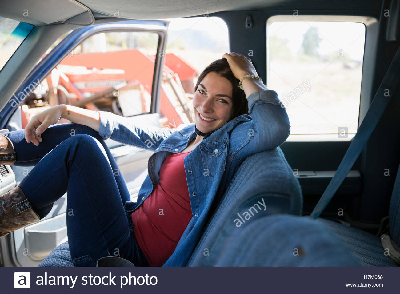 Portrait smiling female farmer in truck Stock Photo - Alamy