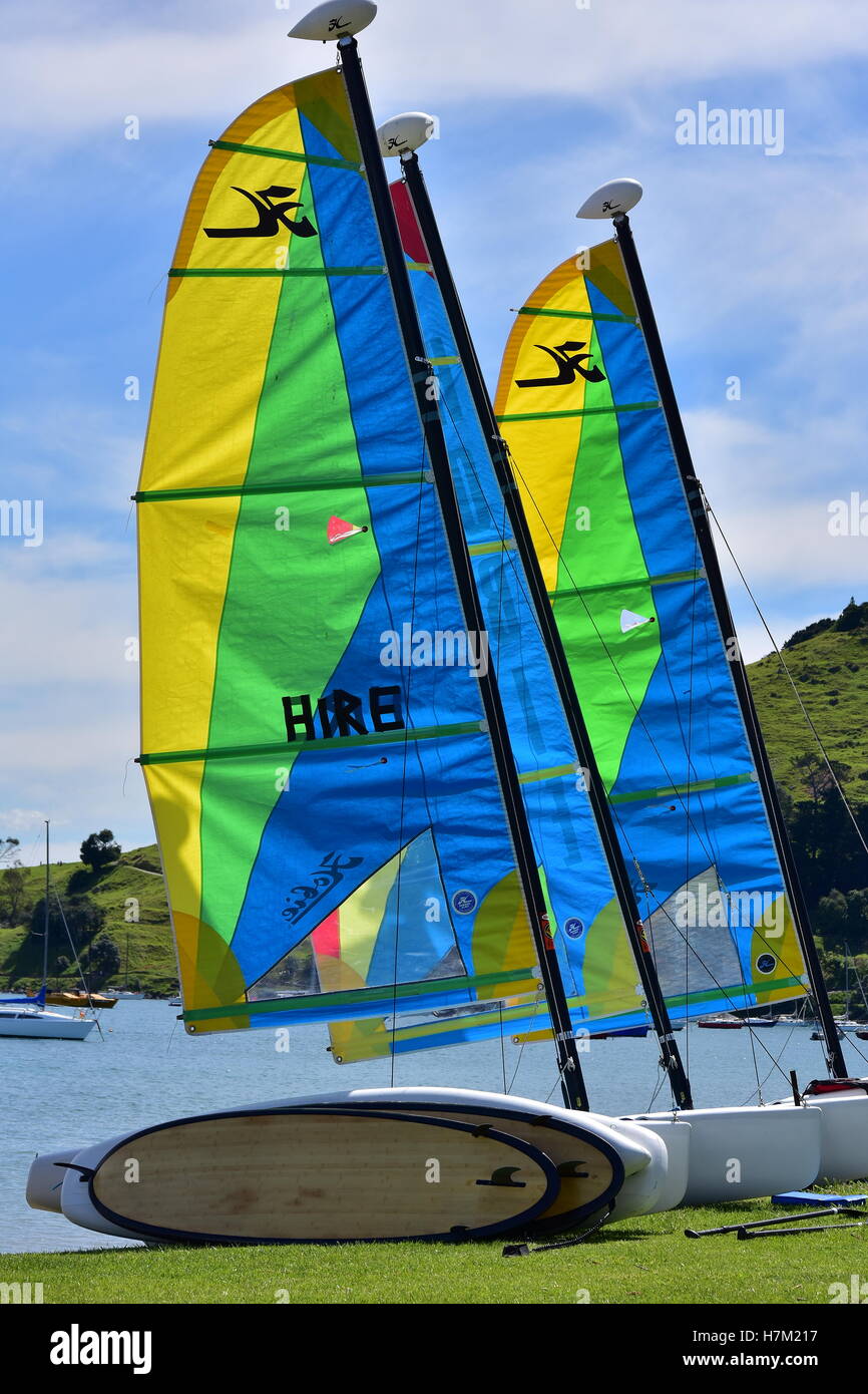 Small boats with colorful sails on the bank Stock Photo Alamy