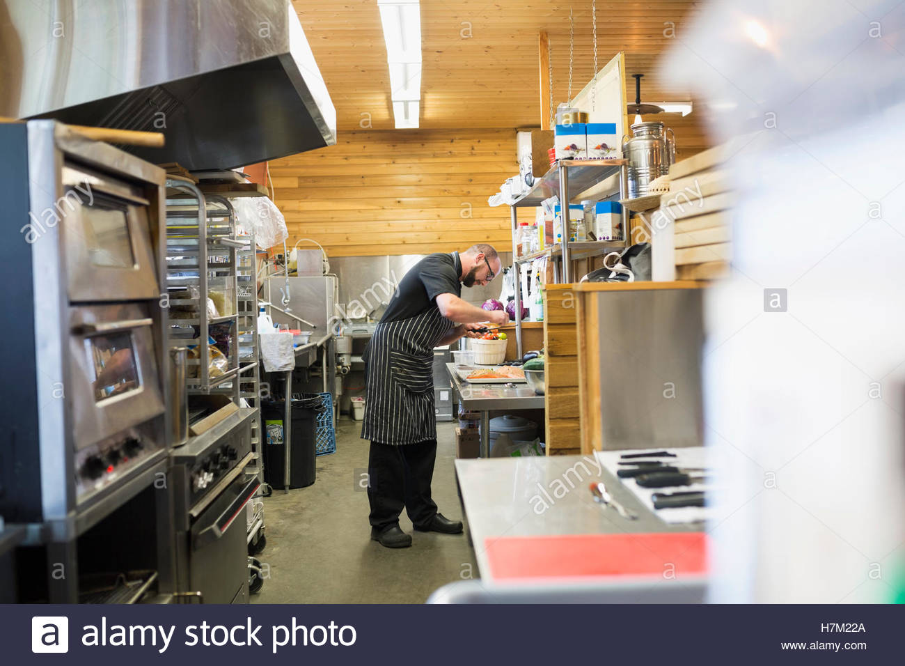 Chef cooking in restaurant commercial kitchen Stock Photo Alamy