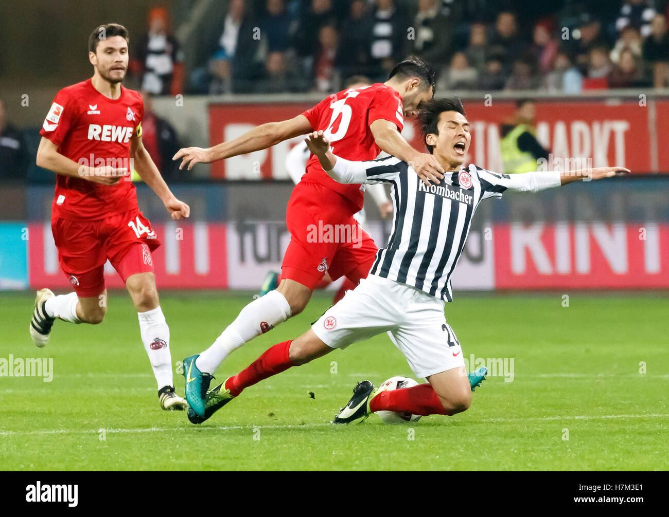Frankfurt's Makoto Hasebe (r) and Cologne's Mergim Mavraj in action during the Bundesliga soccer match between Eintracht Frankfurt and 1. FC Cologne at the Commerzbank-Arena in Frankfurt/Main, Germany, 5 November 2016. PHOTO: RONALD WITTEK/dpa Stock Photo