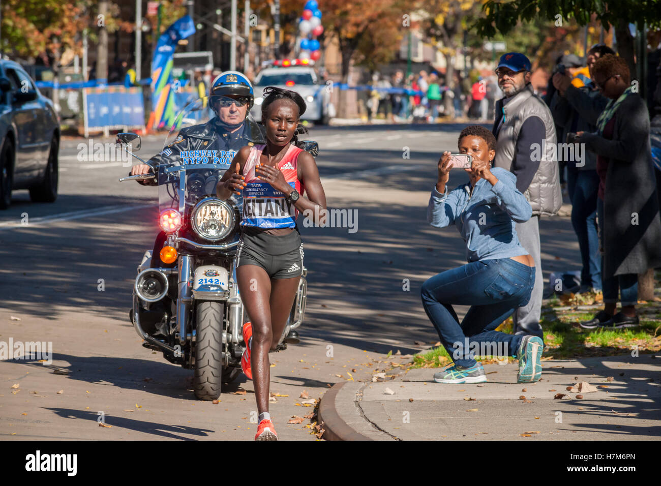 New York, USA. 06th Nov, 2016. Mary Keitany of Kenya passes through Harlem in New York near the 22 mile mark near Mount Morris Park on Sunday, November 6, 2016 in the 46th annual TCS New York City Marathon. Keitany won the women's division of the marathon finishing in 2 hours 24 minutes 26 seconds. This is her third NYC Marathon win, the first such hat trick since Grete Waitz. ( © Richard B. Levine) Credit:  Richard Levine/Alamy Live News Stock Photo