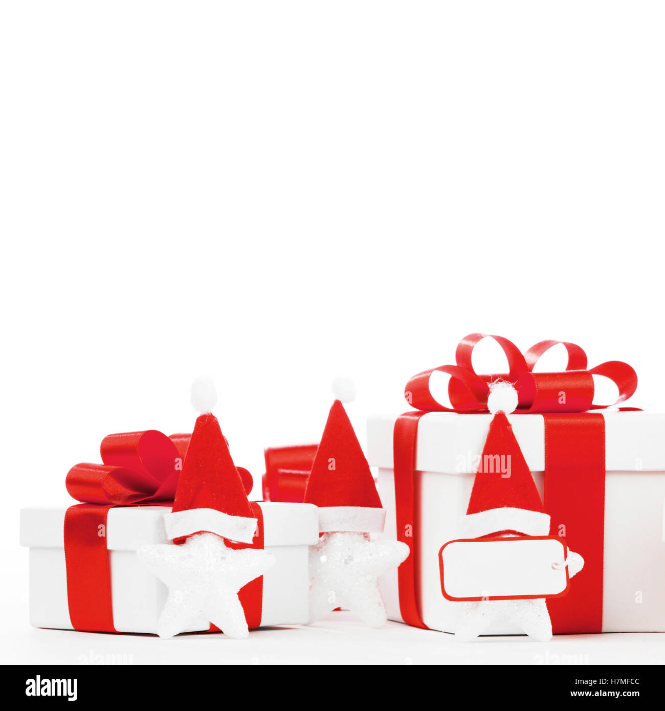 White gift box with red ribbon bow isolated on white background close ...