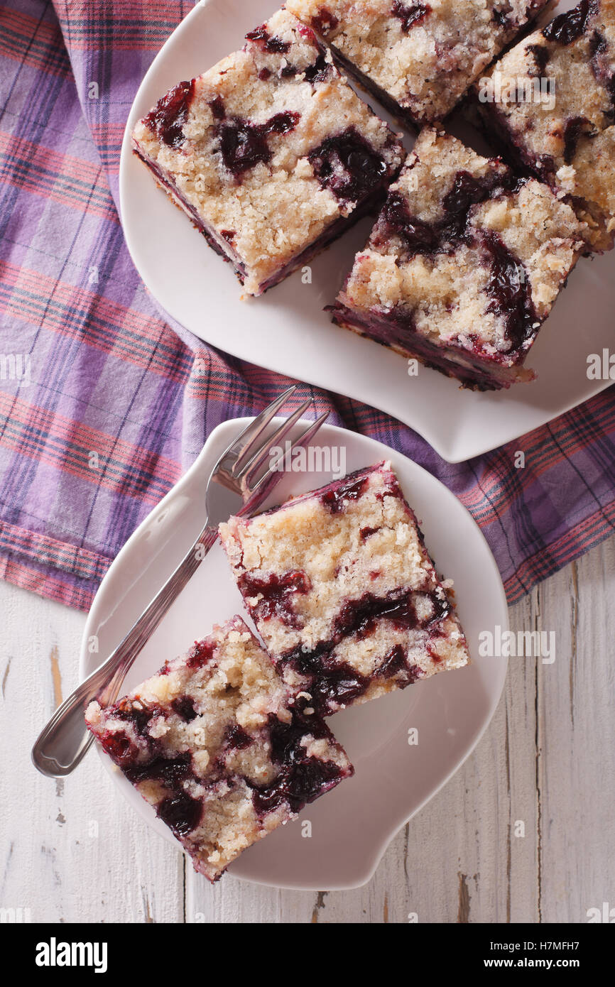 Berry Buckle close up on a plate on the table. Vertical view from above Stock Photo