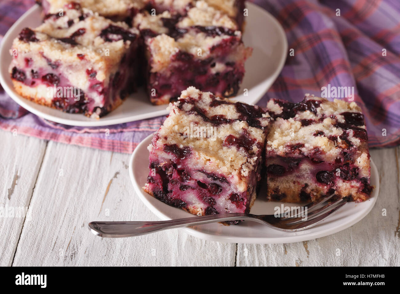 Berry pie with blueberries close-up on a plate on the table. horizontal Stock Photo