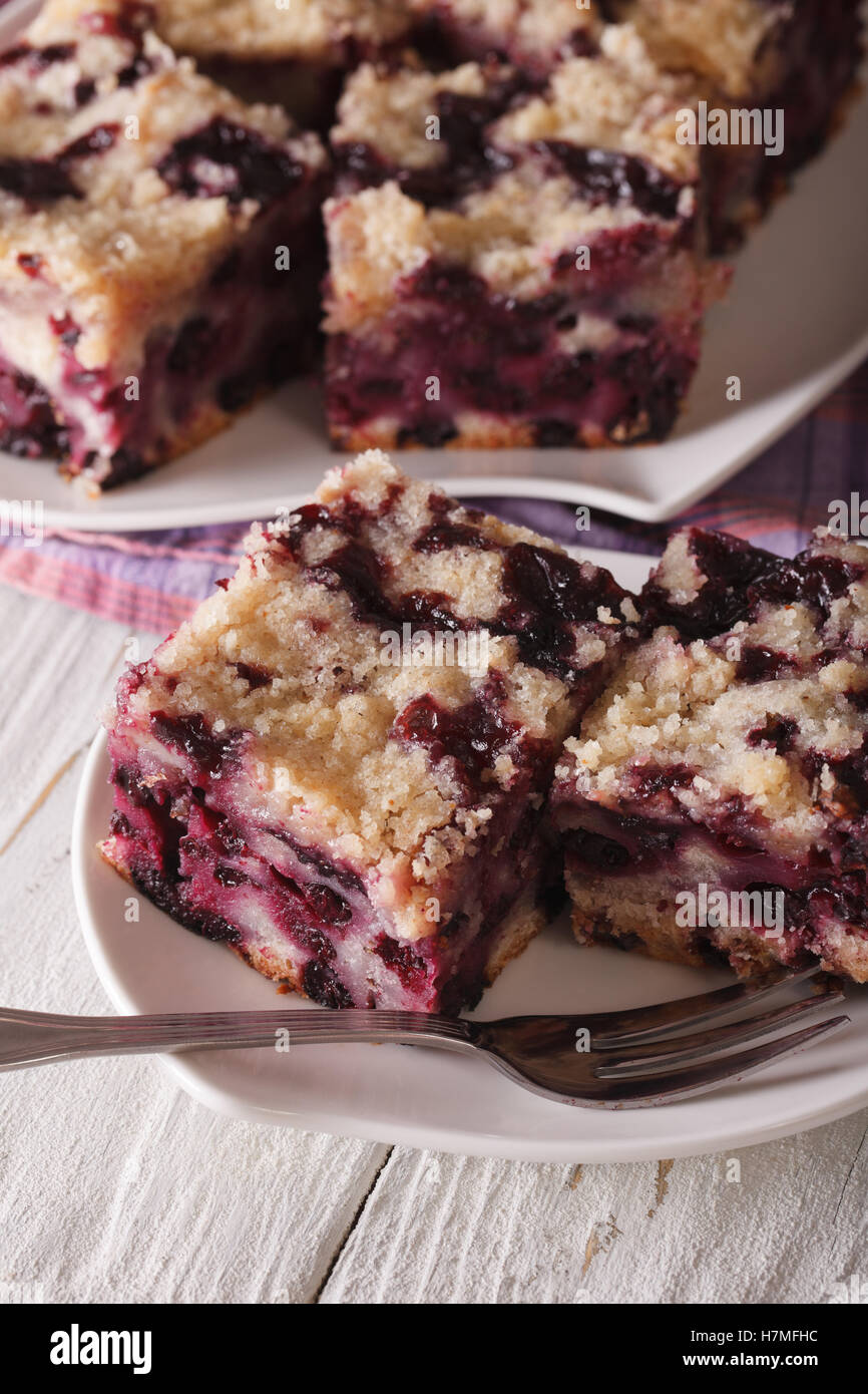 Berry Buckle close up on a plate on the table. Vertical Stock Photo