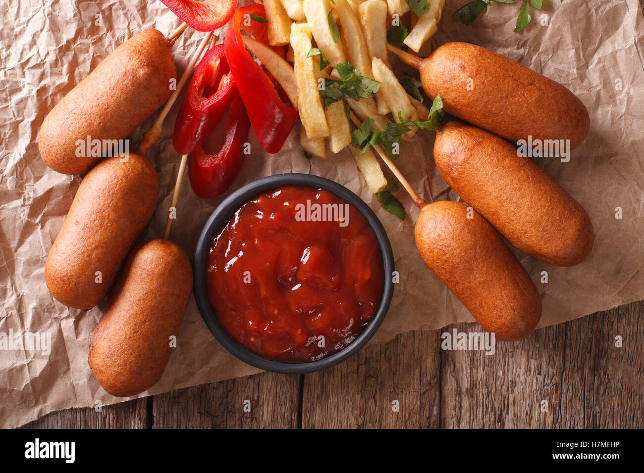 Fast Food: Corn dogs, french fries and ketchup on the table close-up. horizontal view from above Stock Photo