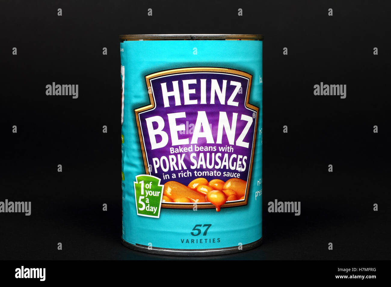 Heinz beans and pork sausages isolated on a black background Stock