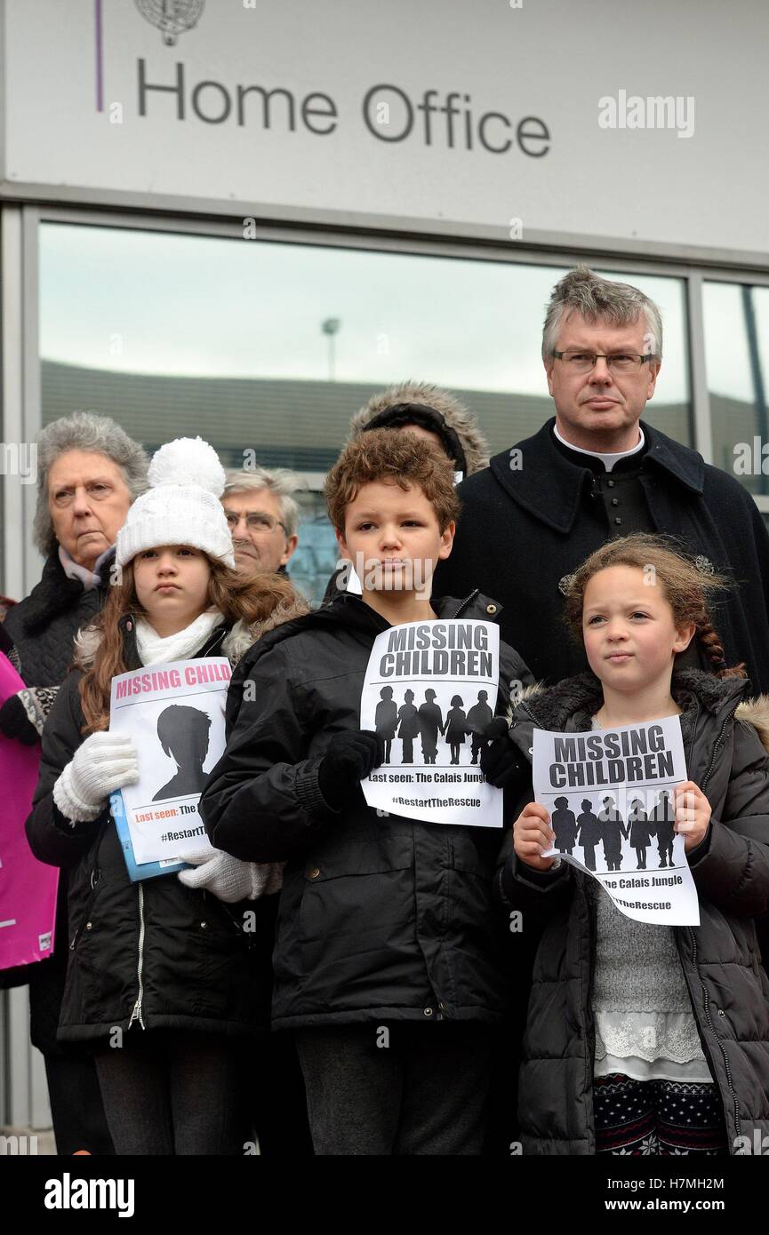 Demonstrators outside the Home Office Lunar House in Croydon, as child