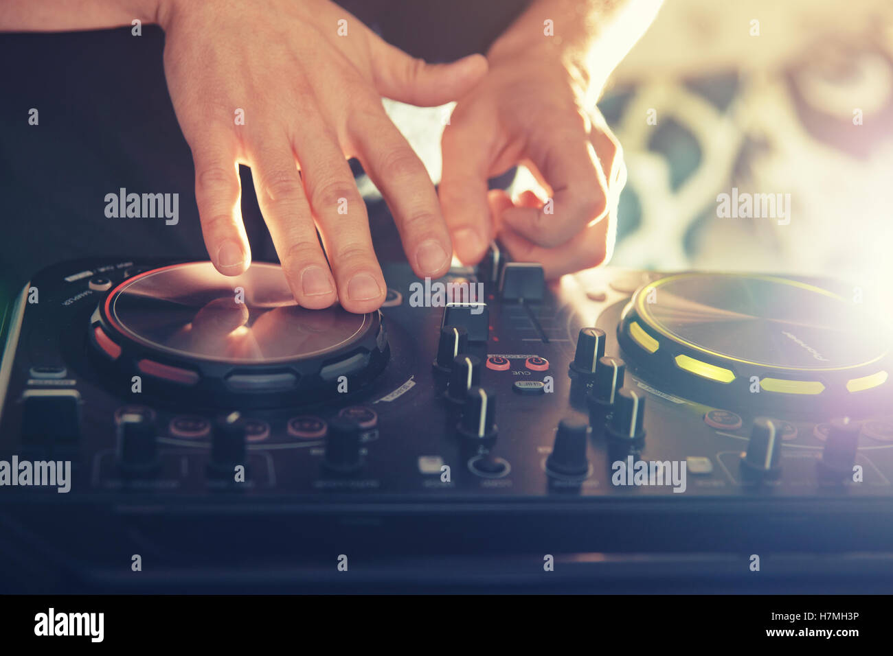 DJ turntable console mixer controlling Stock Photo Alamy