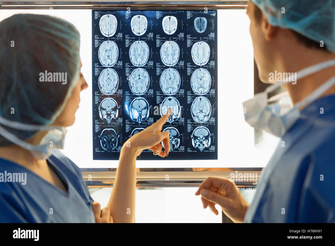 Surgeons examining Xray Stock Photo