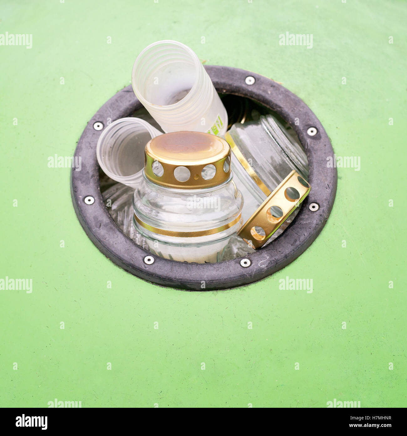 Green recycling bin full of candles Stock Photo Alamy