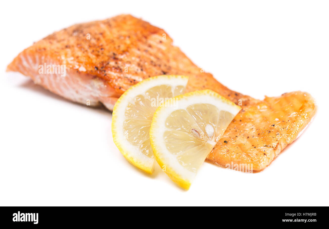 grilled red fish with lemon on white background Stock Photo