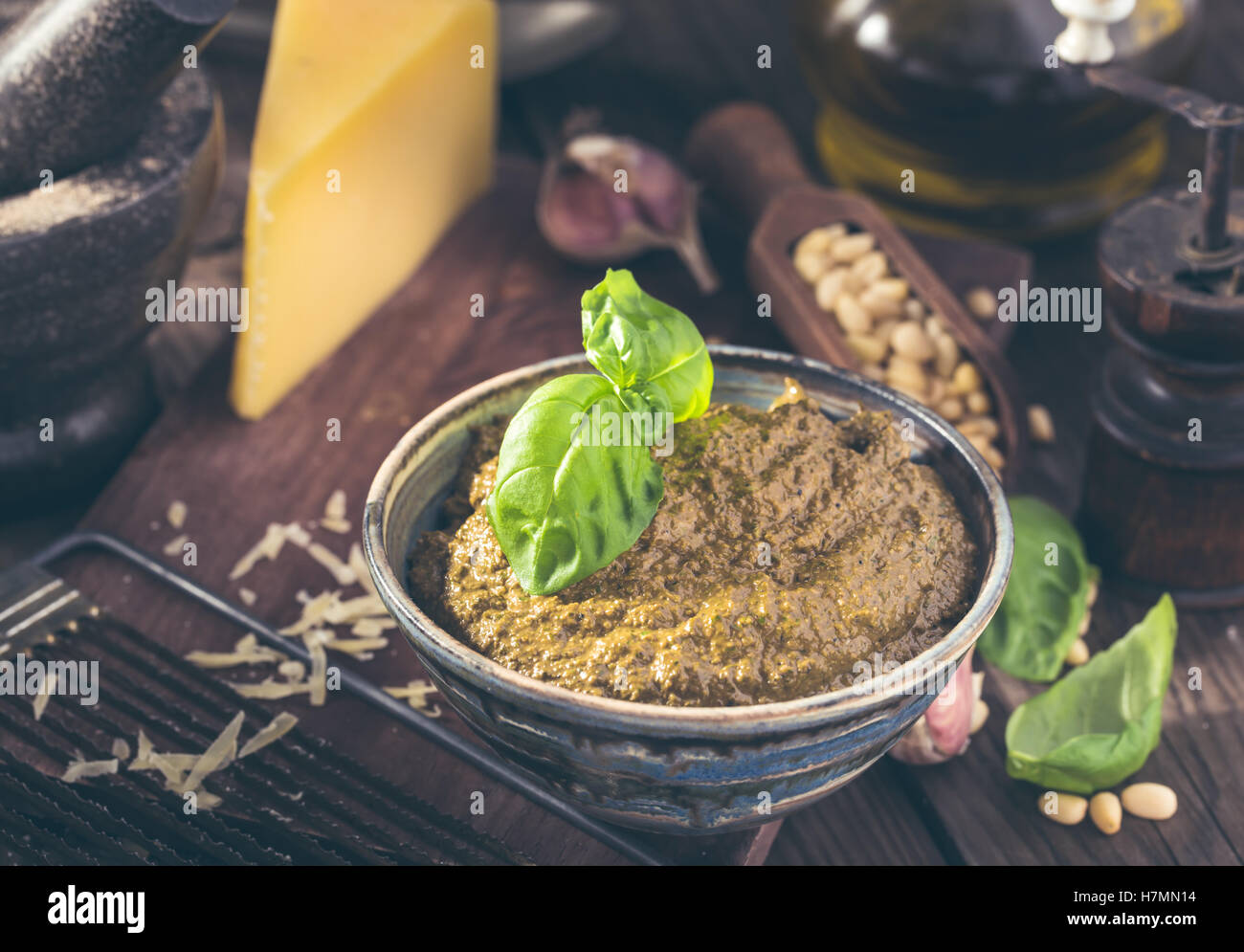 Bowl of fresh italian basil pesto and ingredients Stock Photo