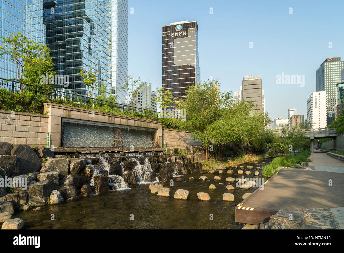 View of the Cheonggyecheon Stream and modern office buildings in Seoul, South Korea, in the morning. Stock Photo