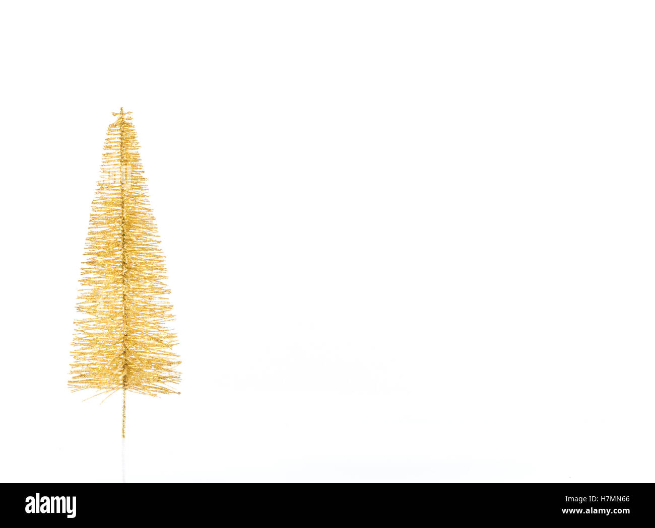 golden Christmas tree isolated on white background with free space for ...