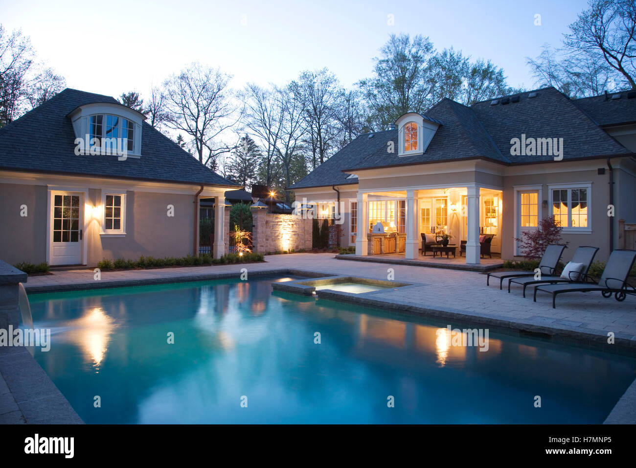 back yard patio and pool at dawn Stock Photo