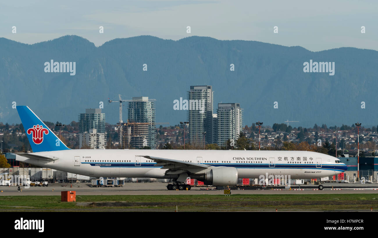 China Southern Airlines Boeing 777-300ER B-2009 taxi runway take-off taking off Vancouver International Airport scene Stock Photo
