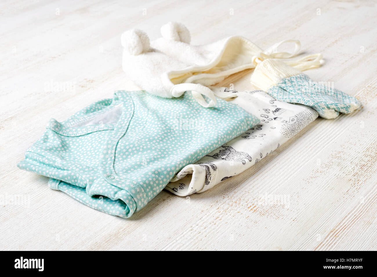 Set of blue baby clothes on wooden background Stock Photo Alamy