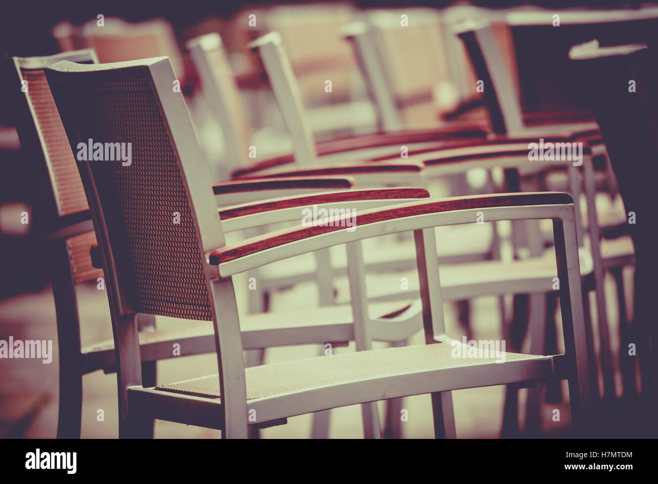 Empty chairs outside popular restaurant in London Stock Photo