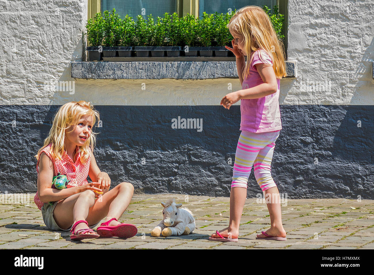 Young Girls At Play Bruges Belgium Stock Photo