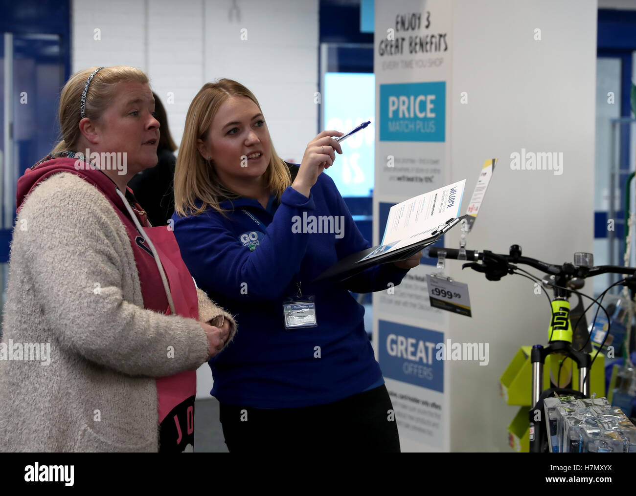 A Go Outdoors Member Of Staff Helps Out A Customer Stock Photo Alamy