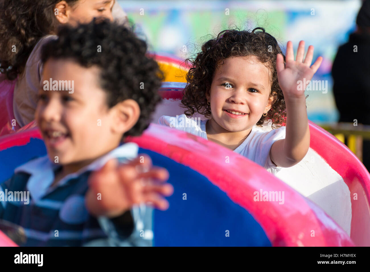 Happy Young Girl Having Fun at Amusement Park Stock Photo - Alamy