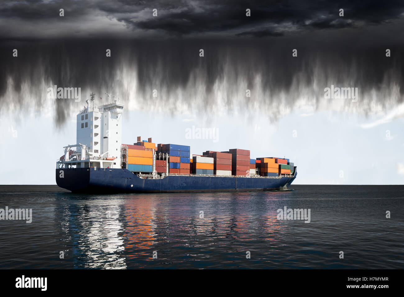 Sea landscape with container ship and rain over ocean. Stock Photo