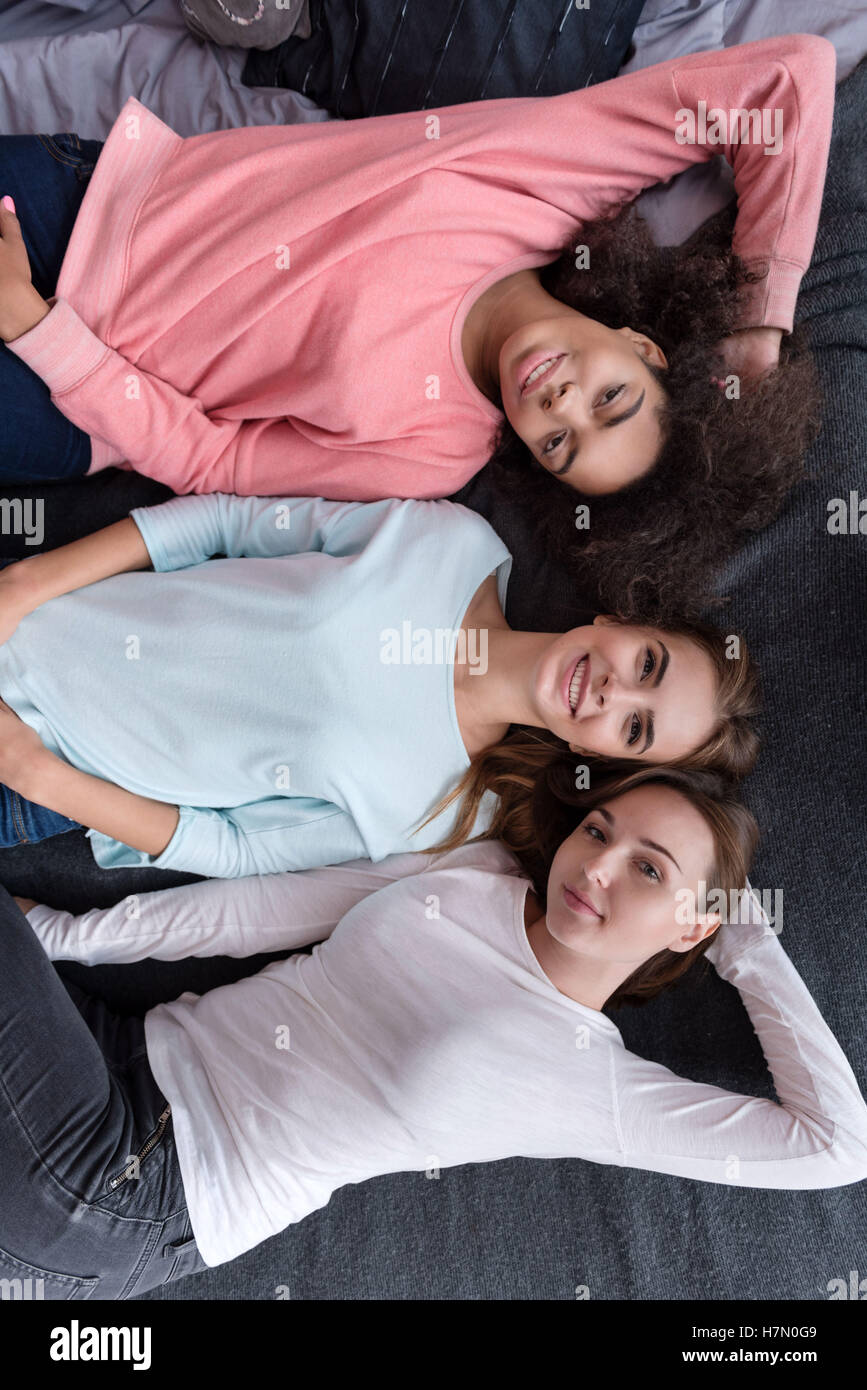 Pretty girls lying on bed hi-res stock photography and images - Alamy