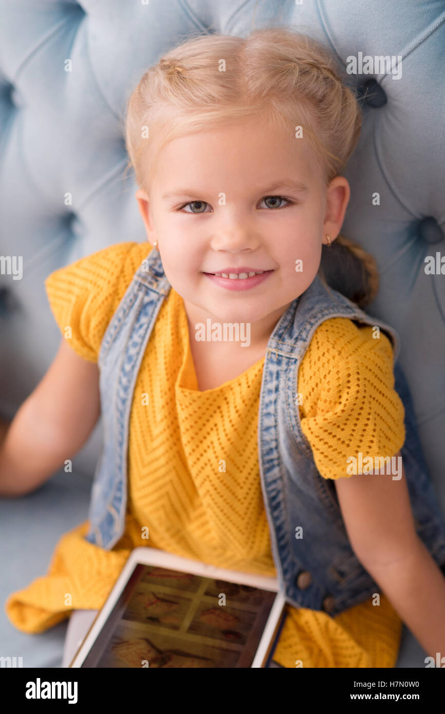 Beautiful happy girl using the tablet Stock Photo