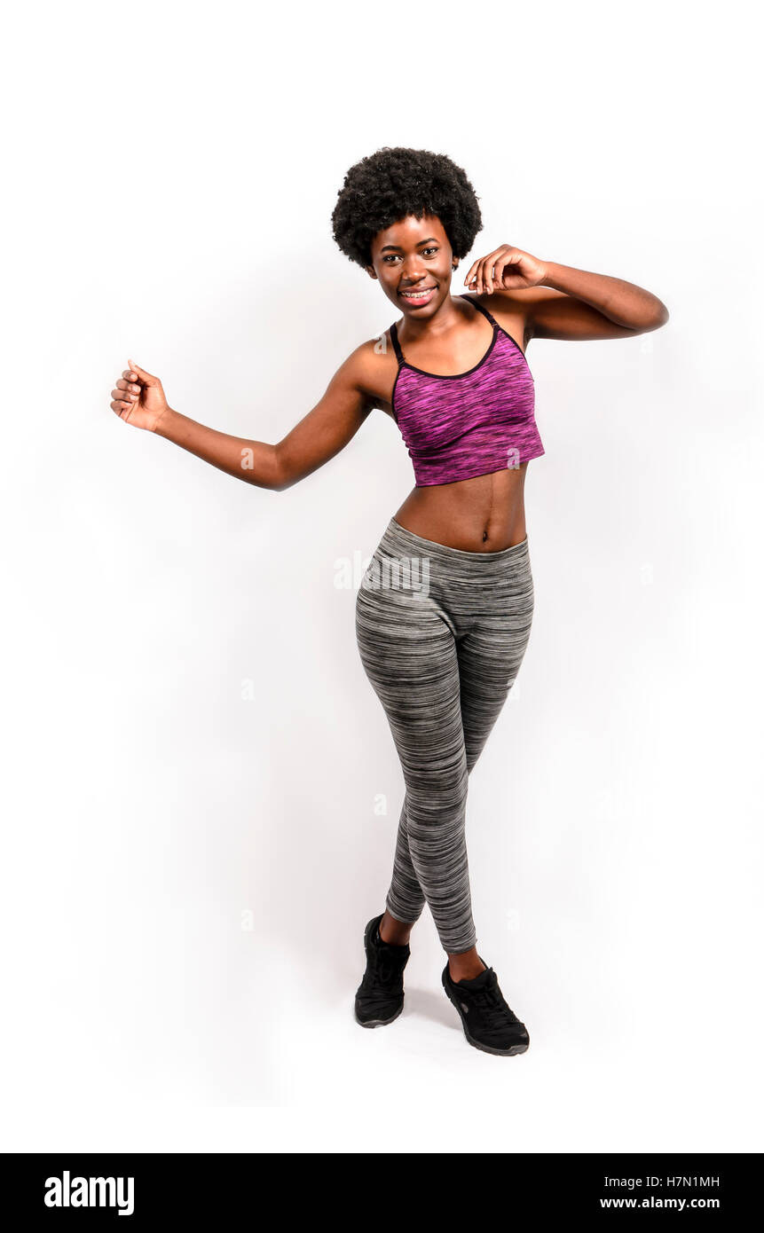 fit black woman dancing over white background Stock Photo