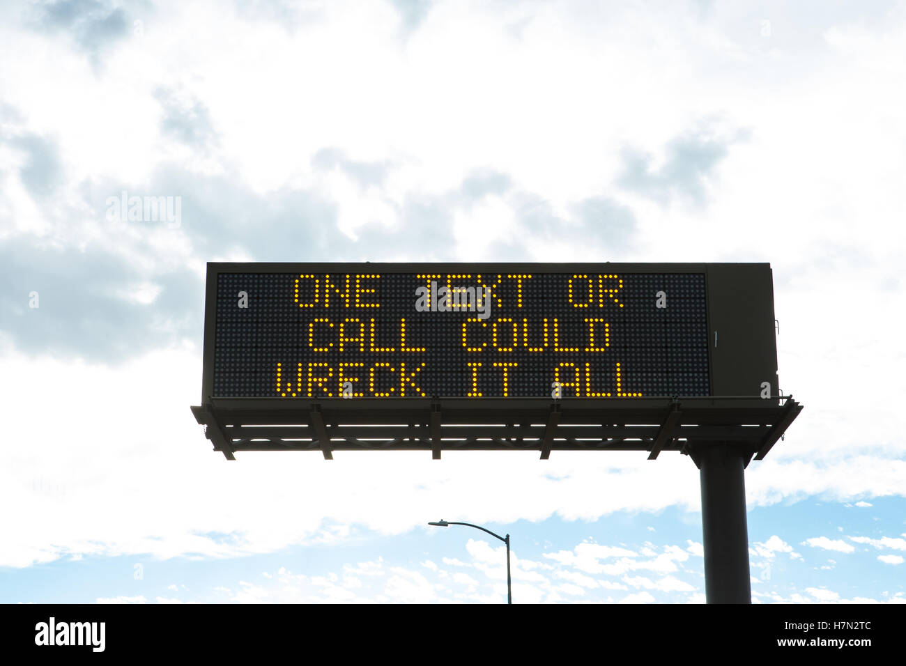 American Highway information warning sign 'One text or call could wreck it all' Stock Photo