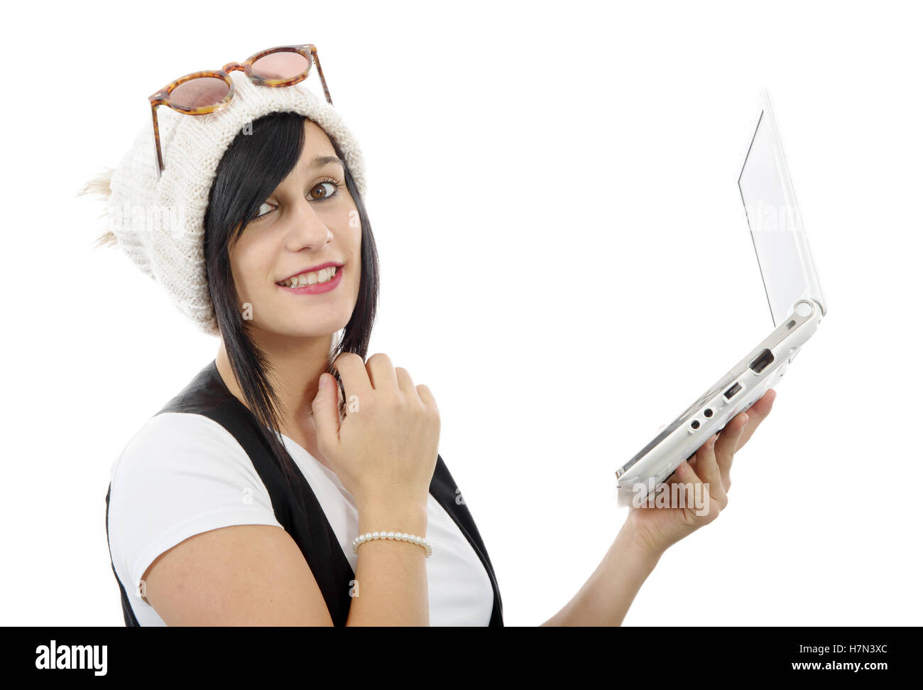 young brunette girl with a laptop isolated on white background Stock ...