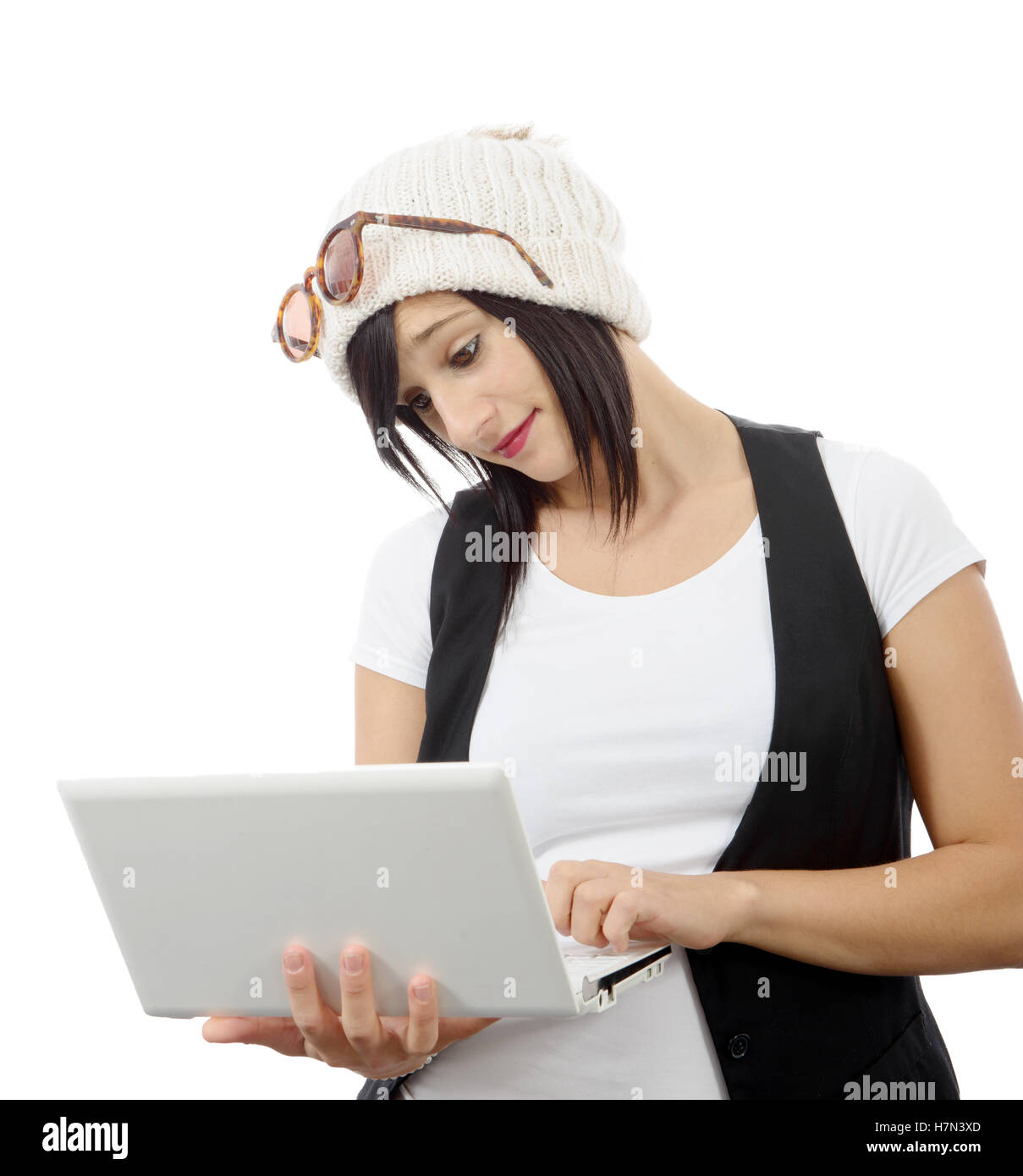 young brunette girl with a laptop isolated on white background Stock ...
