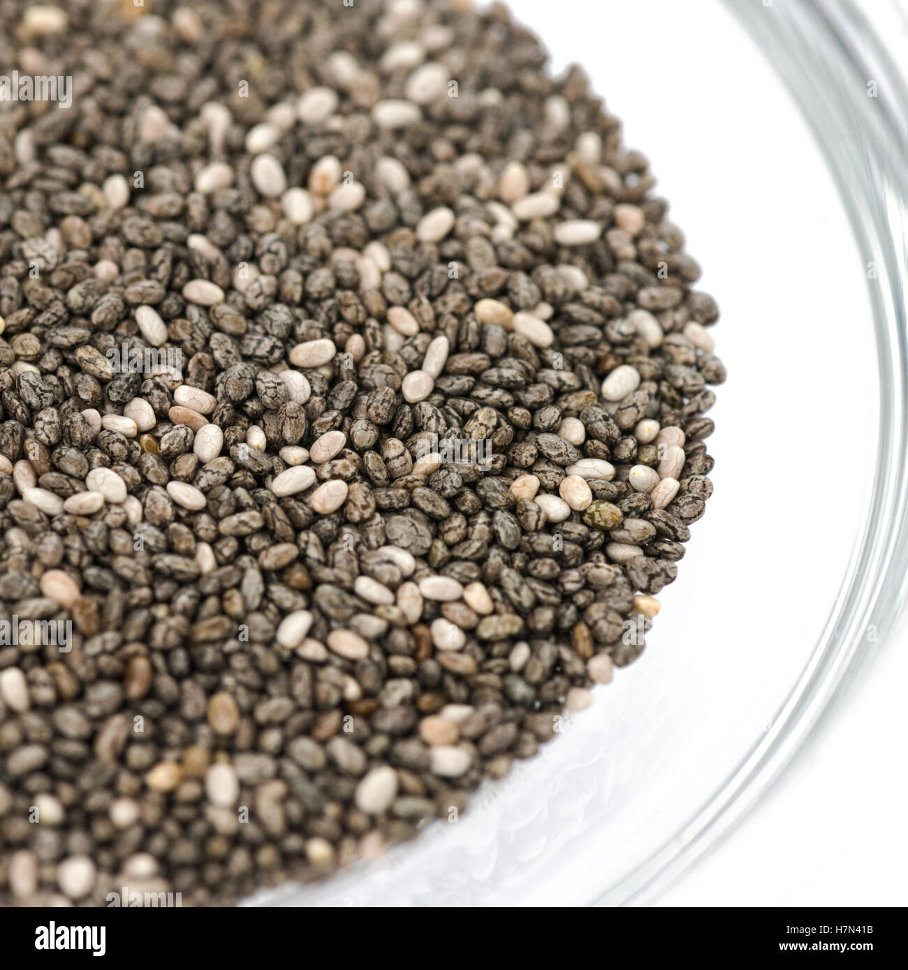 Square image of chia seeds Selective focus in a glass bowl on a white background, Stock Photo