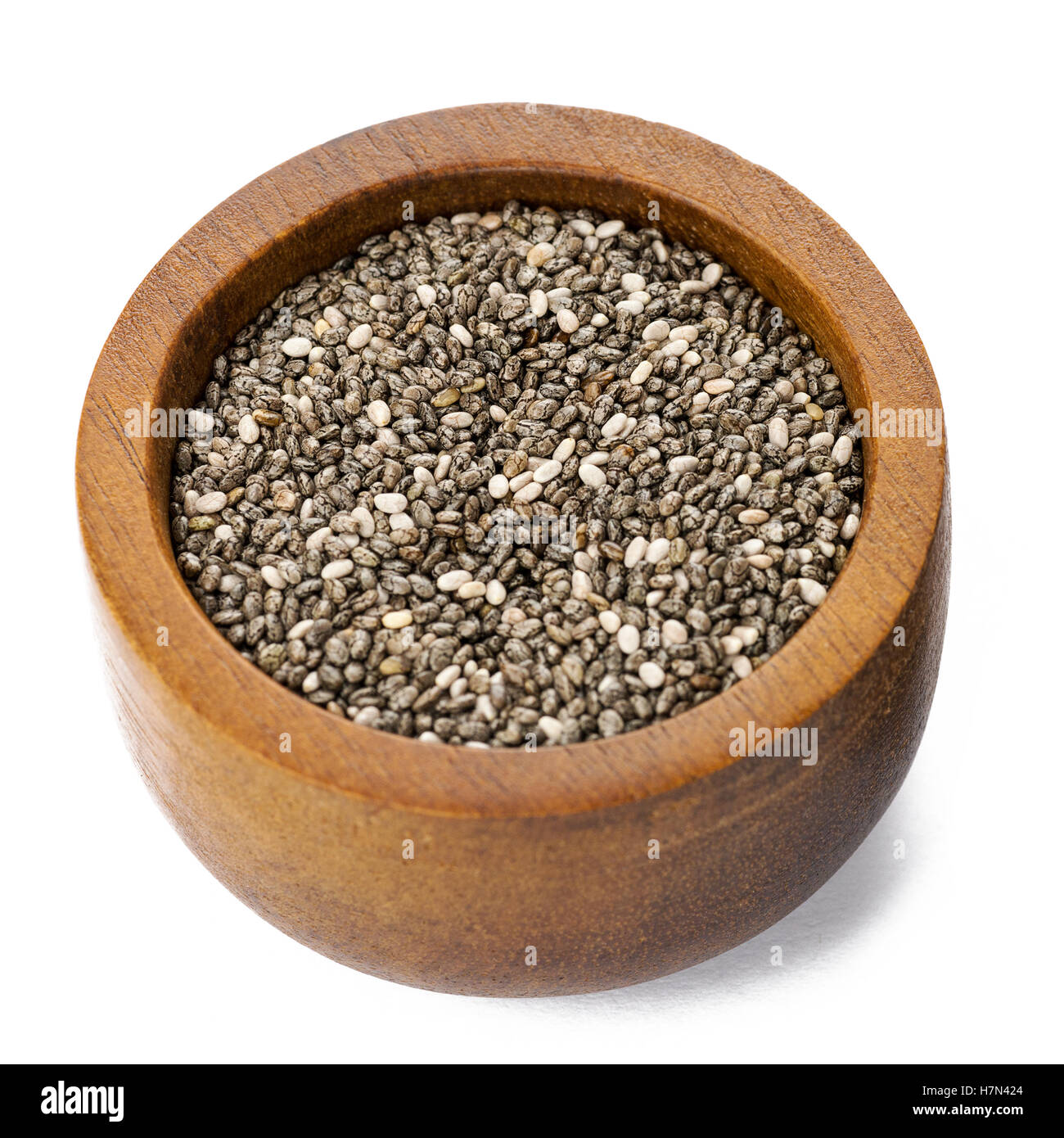 Square image of chia seeds in a small wooden dish ,isolated on white Stock Photo