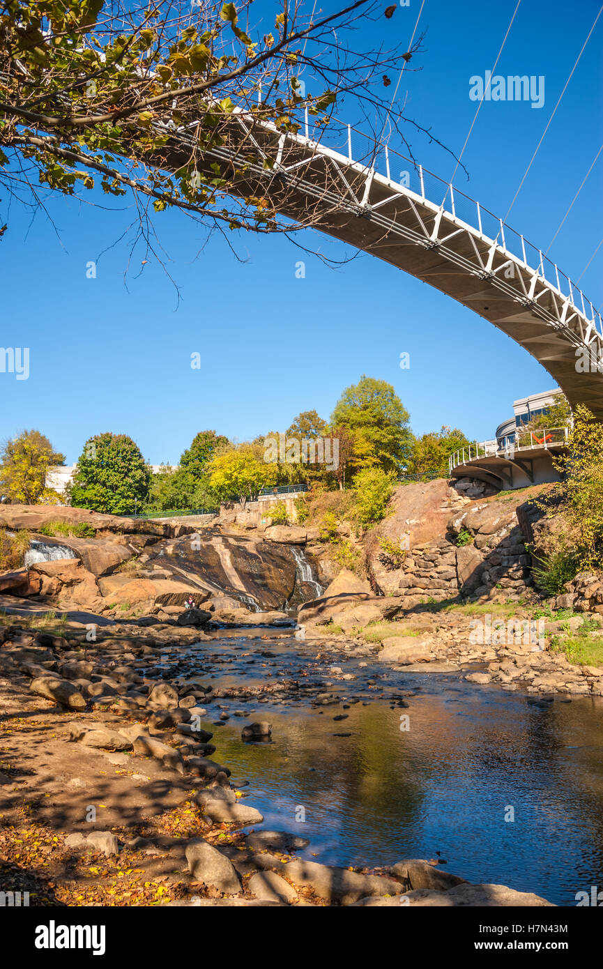 Suspension bridge over the Reedy River in downtown Greenville, South Carolina's Falls Park on the Reedy. (USA) Stock Photo