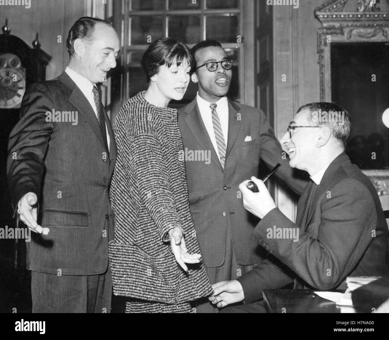 Canon L. John Collins, Precentor of St Paul's, listens to the Dave Lambert Singers in the Chapter House of the Cathedral. (l-r) Dave Lambert, Annie Ross and Jon Hendricks will be appearing at a concert in aid of the Christian Action Race Relations Fund. Stock Photo