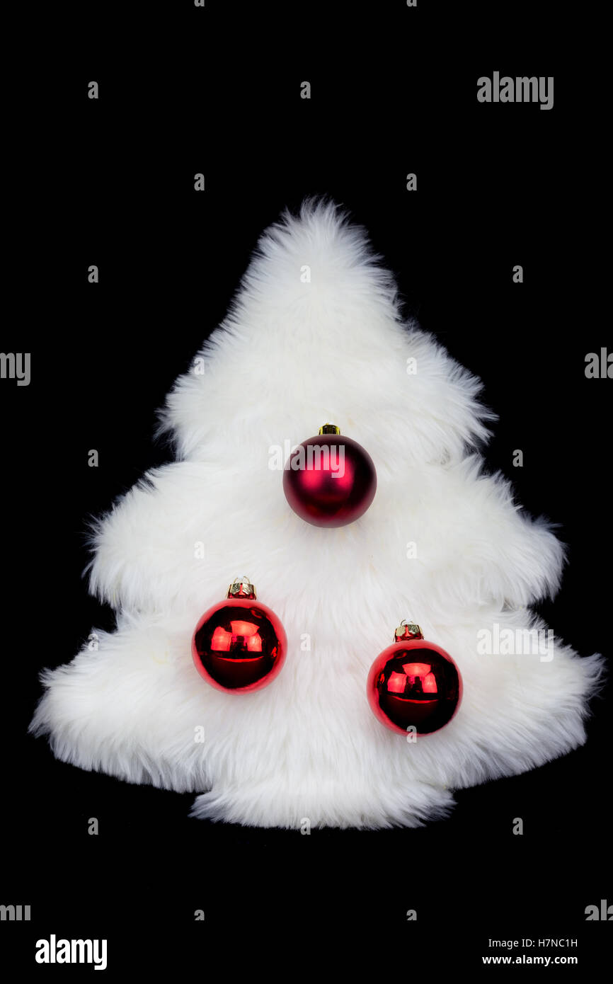 White hairy christmas tree isolated on black background Stock Photo