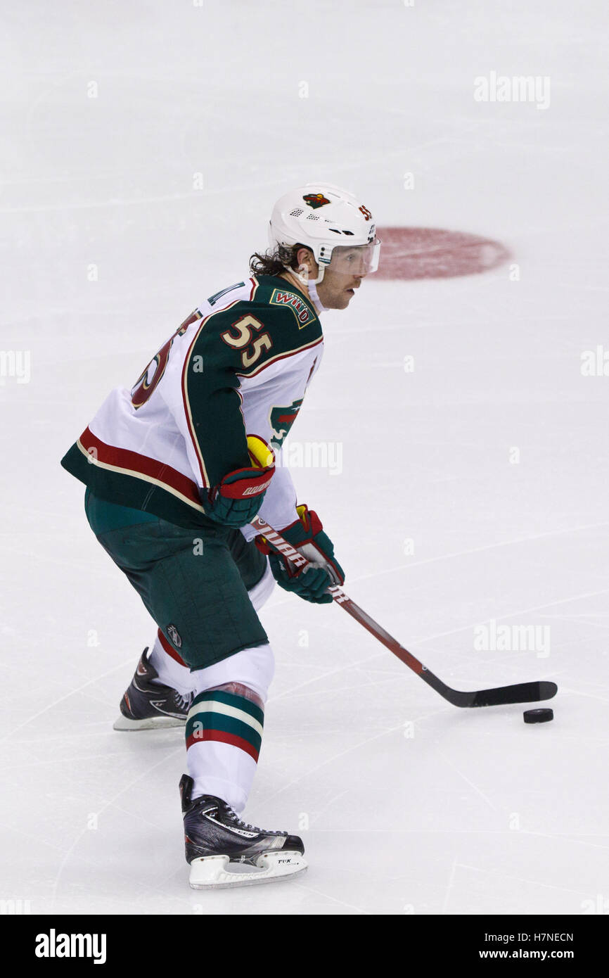 Nov 10, 2011; San Jose, CA, USA; Minnesota Wild defenseman Nick Schultz (55) skates with the puck during the second period at HP Pavilion.  San Jose defeated Minnesota 3-1. Stock Photo