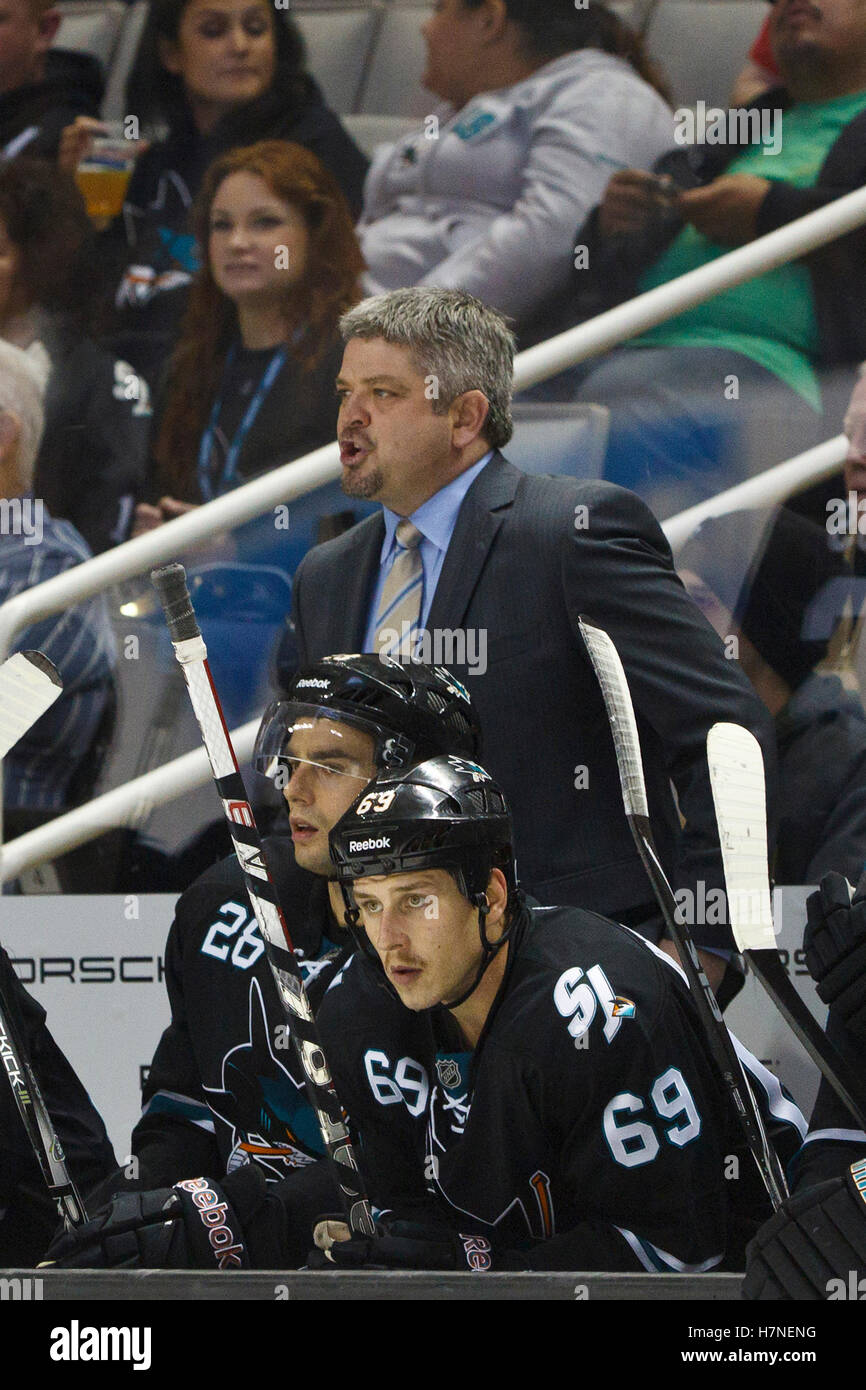 Nov 17, 2011; San Jose, CA, USA; San Jose Sharks head coach Todd McLellan stands behind the bench against the Detroit Red Wings during the third period at HP Pavilion. San Jose defeated Detroit 5-2. Stock Photo
